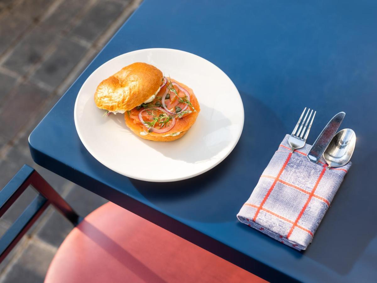 The Standard London Hotel Exterior photo A bagel with cream cheese and tomato