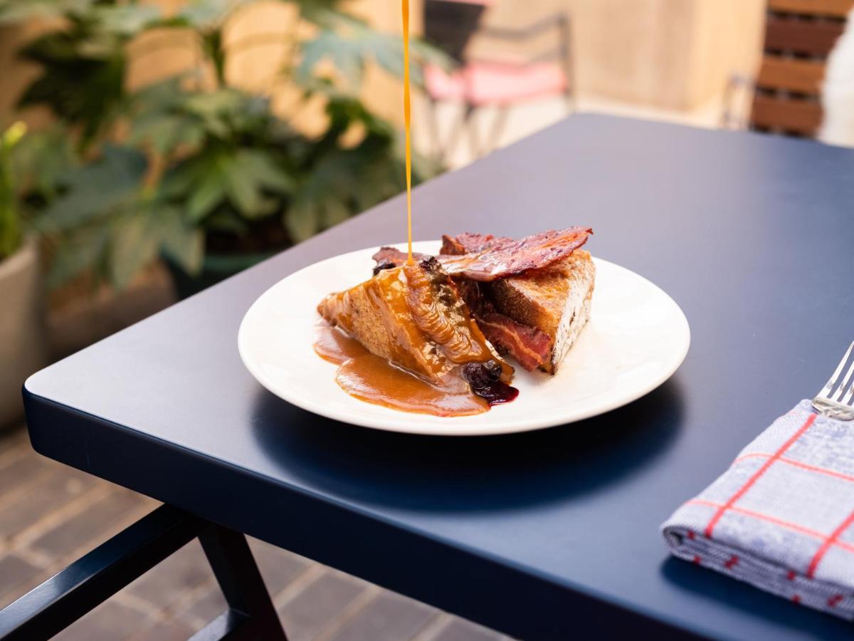 The Standard London Hotel Exterior photo A piece of French toast with maple syrup