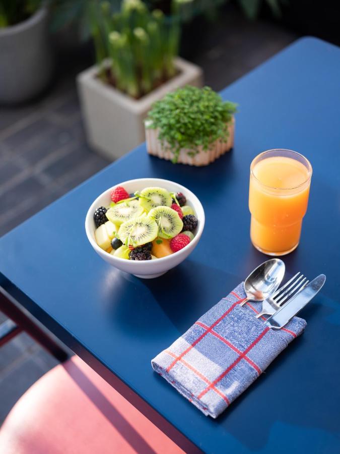 The Standard London Hotel Exterior photo Fruit salad with orange juice